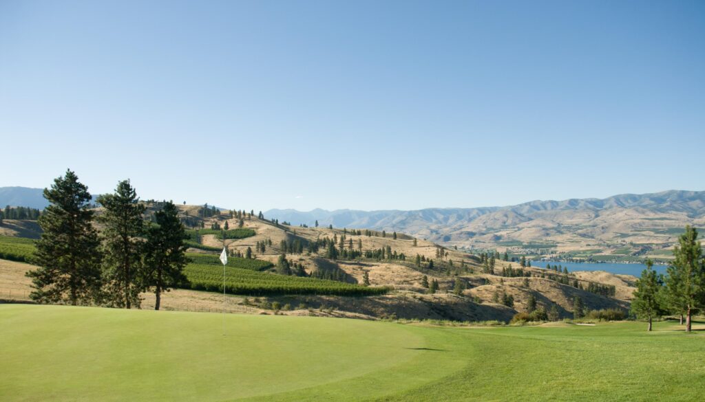 A landscape view of the bear mountain ranch golf course with a white flagstick